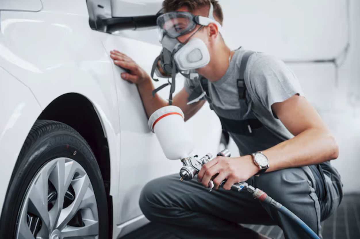 LMG technician preparing a vehicle bumper for repair